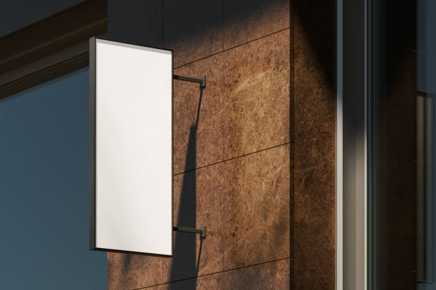 istock Rectangle sign board mockup mounted on brown concrete wall in the street 1630975905