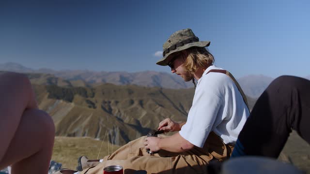 The sun-kissed mountain landscape stretches out, inviting viewers to partake in the spirit of adventure and exploration. The distant horizons beckon, promising endless opportunities for discovery and self-discovery. This video encapsulates the essence of