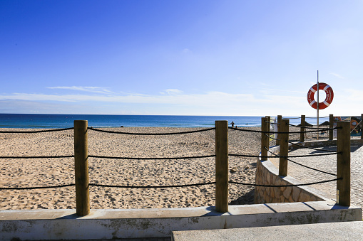 Vila do Bispo, Portugal- October 20, 2022: Beautiful Salema Beach on a sunny day in Algarve, Portugal
