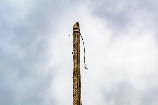 Power electric pole with line wire on colored background close up, photography consisting of power electric pole with line wire under sky, line wire in power electric pole for residential buildings