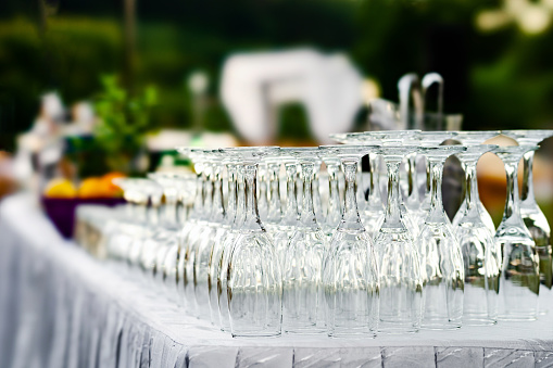 Glasses at outdoor catering event. Catering and restaurant utensils.