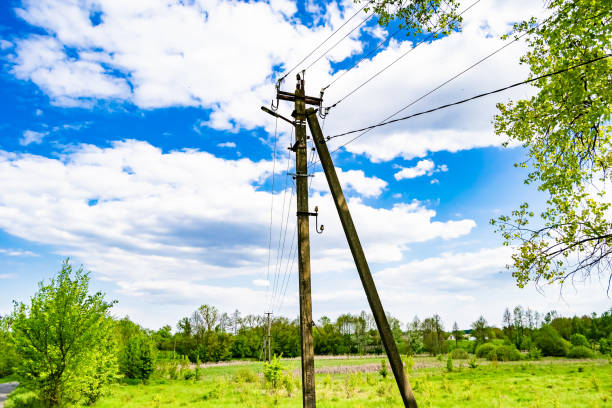 istock Power electric pole with line wire on colored background close up 1631004573