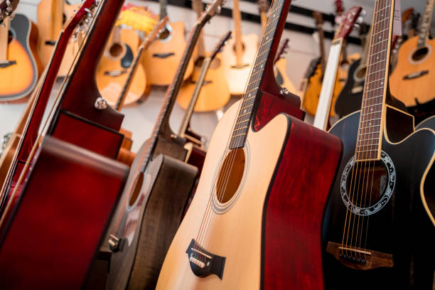 istock Many rows of classical guitars in the music shop 1631005113