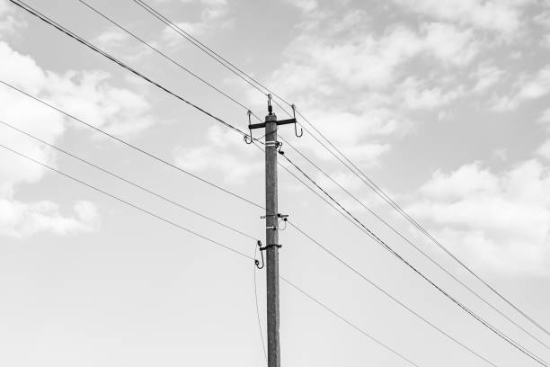 Power electric pole with line wire on dark background close up, photography consisting of power electric pole with line wire under sky, line wire in power electric pole for residential buildings