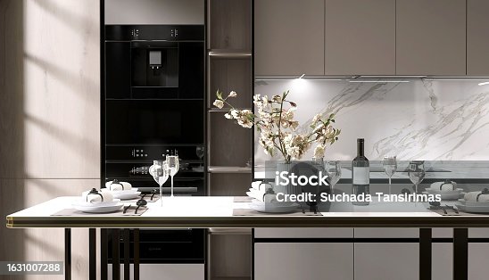 istock Close up of elegant, luxury dining table, white table wear, bouquet, wine glass in beige cabinet, cupboard modern kitchen in sunlight 1631007288