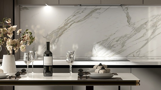 Close up of elegant, luxury dining table, white table wear, bouquet, wine glass in beige cabinet, cupboard modern kitchen in sunlight
