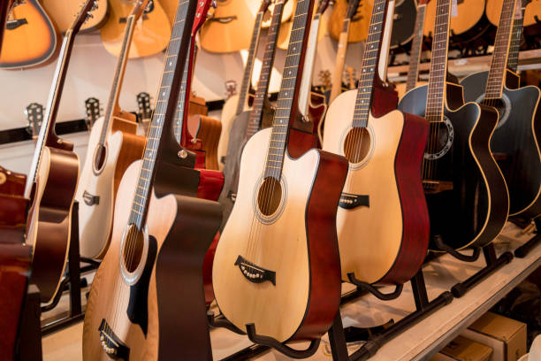 istock Many rows of classical guitars in the music shop 1631012721