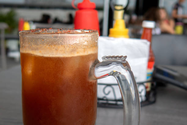 istock Authentic Michelada - A Refreshing Mexican Beer Cocktail with Clamato and Chamoy 1631038046