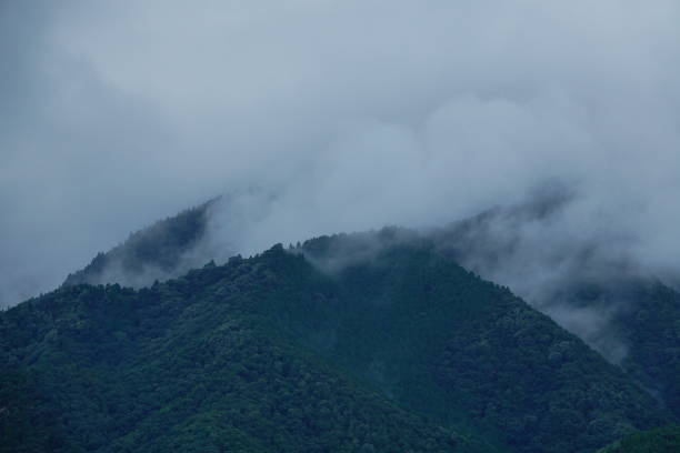Green mountains shrouded in mist and clouds in Takashima, Shiga, Japan. (Shot in Omi-Takashima Station)