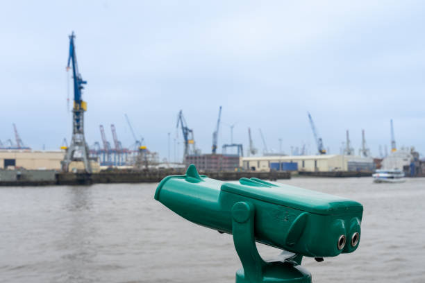 istock Telescope against Hamburg harbor 1631048633