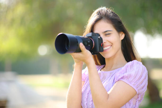 istock Happy photographer working with mirrorless camera 1631055215