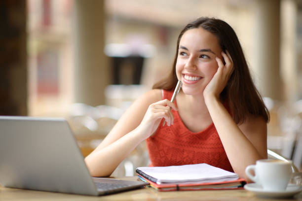 istock Happy student dreaming in a restaurant 1631057354