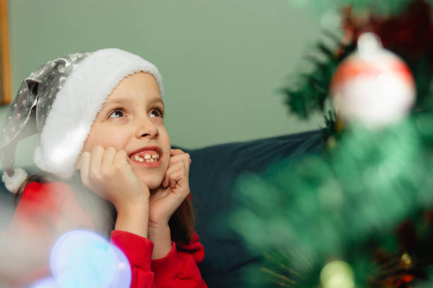 istock Girl lying on sofa at Christmas 1631061756