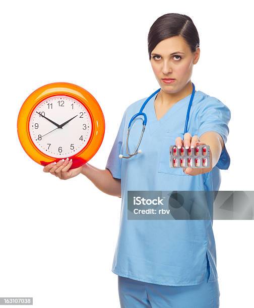 Young Doctor With Pills And Clock Stock Photo - Download Image Now - 20-29 Years, Adult, Adults Only