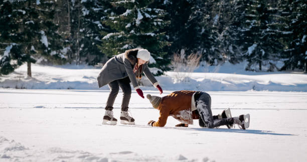 istock Man lying on frozen lake 1631081284