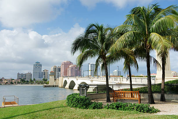 West Palm Beach cityscape viewed across Intracoastal Waterway West Palm Beach, Florida cityscape seen from Palm Beach across the Intracoastal Waterway. west palm beach stock pictures, royalty-free photos & images