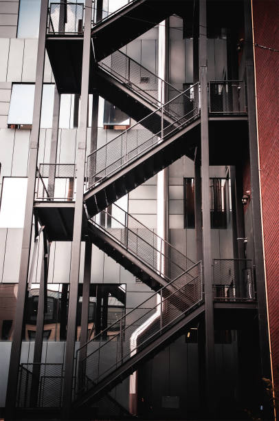 istock Metal staircase, ladder behind a building. Stairway 1631116697