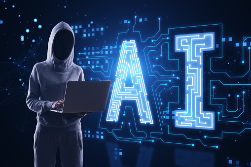 Hacker in hoodie using laptop with glowing digital polygonal AI hologram on dark background. Artificial intelligence, metaverse and technology concept