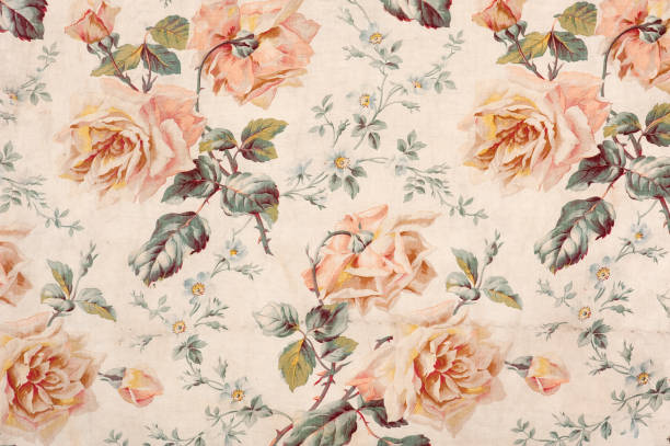 Medley Rose Close Up Antique floral fabric with clusters of pink flowers on a beige background.. floral pattern stock pictures, royalty-free photos & images