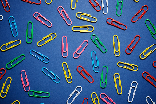 Paperclips group on a blue table.