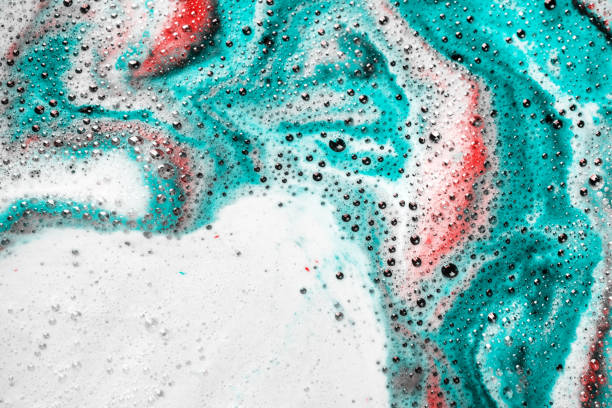 istock Foam of bath bomb dissolved in water. Soap sud background. 1631173969