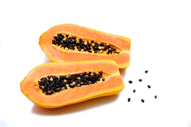 istock Papaya cut in half, isolated on white background 1631181018