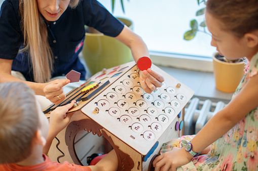Occupational therapist working with children of preschool and elementary age, learning and developmental difficulties