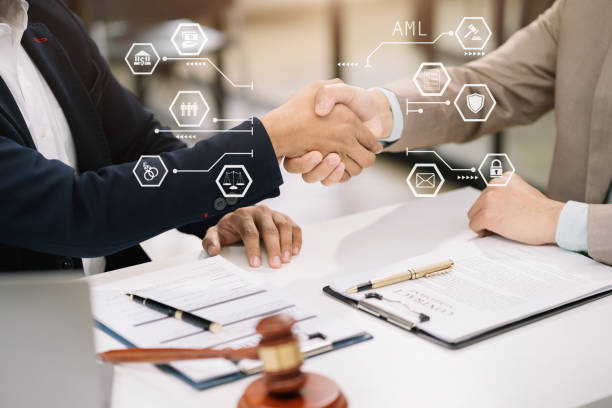 istock Middle age partner lawyers attorneys shaking hands after discussing a contract agreement done. 1631198561