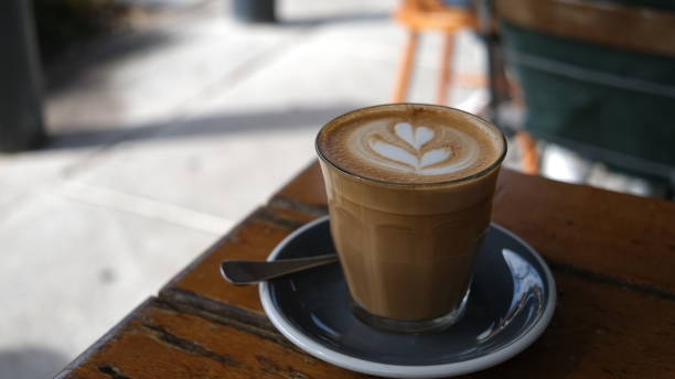 istock A cup of coffee latte on a wooden table. 1631235438