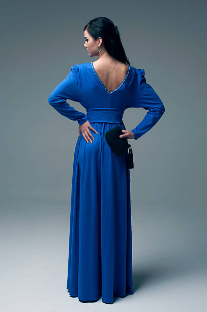 istock girl in a blue evening dress 163125732