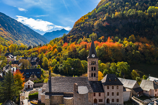 Autumn mountain village with a church