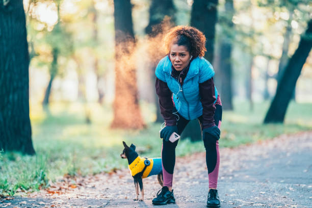 istock Sportswoman taking a breath after jogging 1631270871