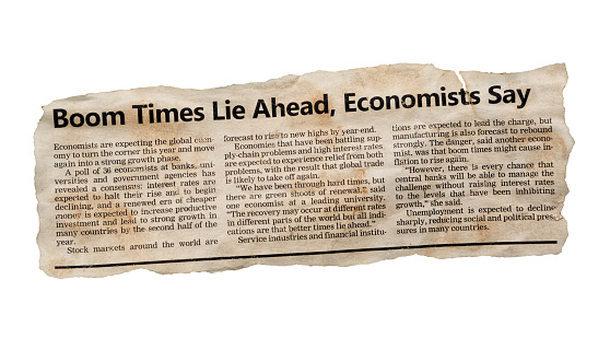 Simulated newspaper clipping featuring an article about economists being optimistic about better times in the near future for the global economy. Tattered and torn, so perhaps ironic and nostalgic for better times. Text was written from scratch by the photographer (an experienced journalist), who also did the design, so this image is free of third-party copyright and may be used without restrictions.