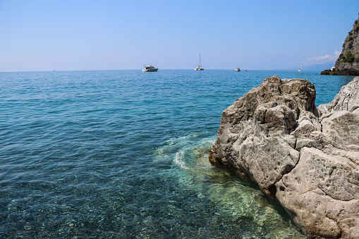 Acquafredda beach near Maratea (Basilicata, Italy) with calm sea in summer season. Beach with calm sea and rocks.
