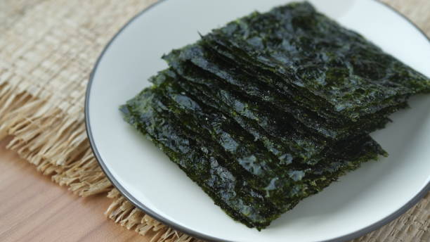 istock Thin nori seaweed on a white plate. 1631312089