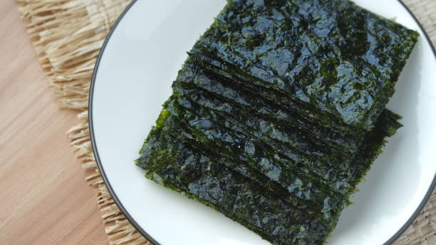 istock Thin nori seaweed on a white plate. 1631320462