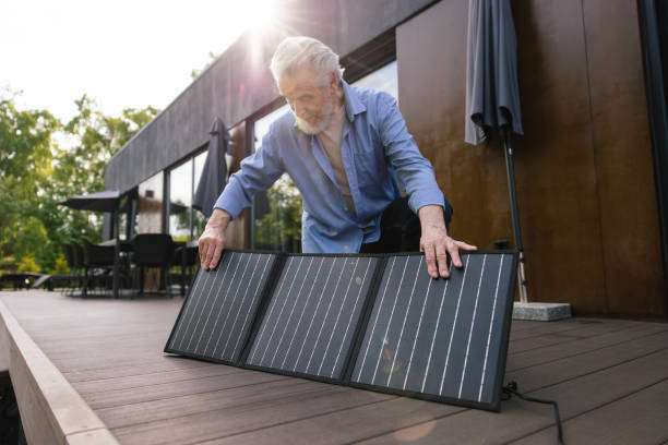 Caucasian man with solar panel innovation technology alternative energy.