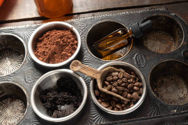 istock Antique baking tray with roasted coffee beans, ground coffee, fresh cocoa and essential oils. 1631349614