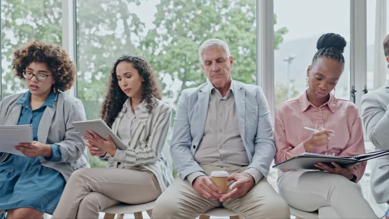 Office, business people and waiting room for hiring, recruitment and job opportunity. Group, human resources and workers in line for onboarding, hr or career interview for employment in workplace