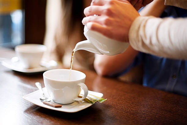 istock Waitress pouring cup of coffee/tea 163136318