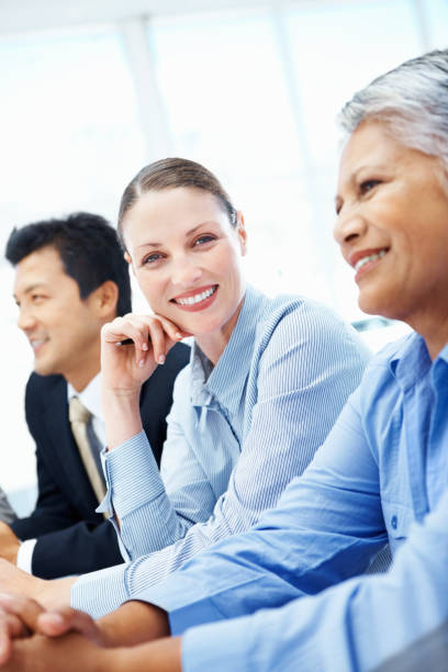 istock Smiling business woman during a meeting 163136893