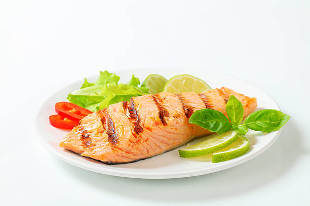 Grilled salmon steak on a plate Grilled salmon steak on a plate salmon seafood stock pictures, royalty-free photos & images