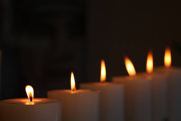 istock row of 6 candles with yellow flame 1631390185