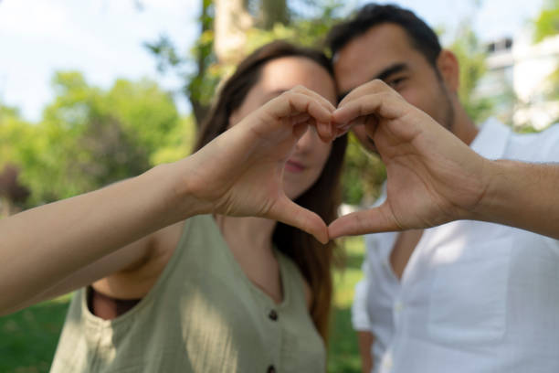istock Heart shape from couple hands 1631395529