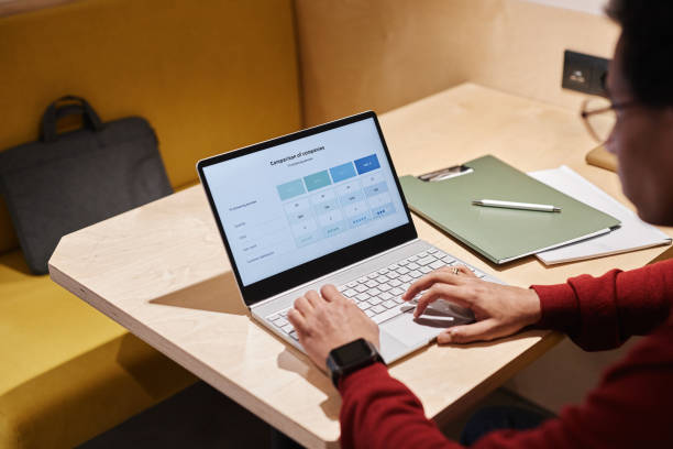 istock Young man using laptop at coworking space in small booth with , copy space 1631428669