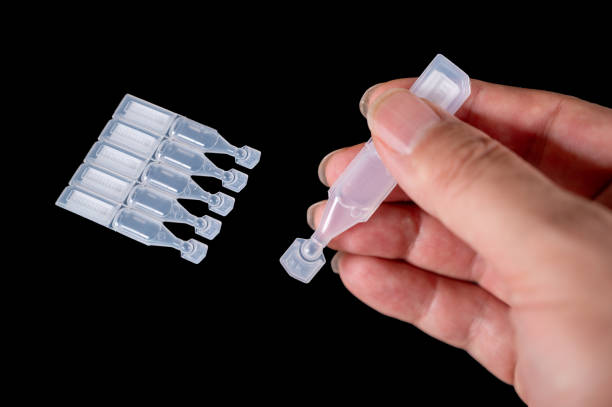 istock Disposable eye drops isolated on black background 1631429434