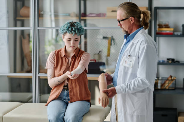 istock Young woman with colored hair fitting for prosthetics 1631439701