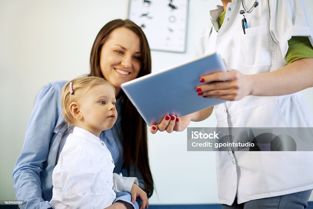Doctor showing results on the tablet Child Stock Photo