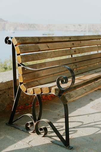 Elegant wooden bench in Lindos, Greece