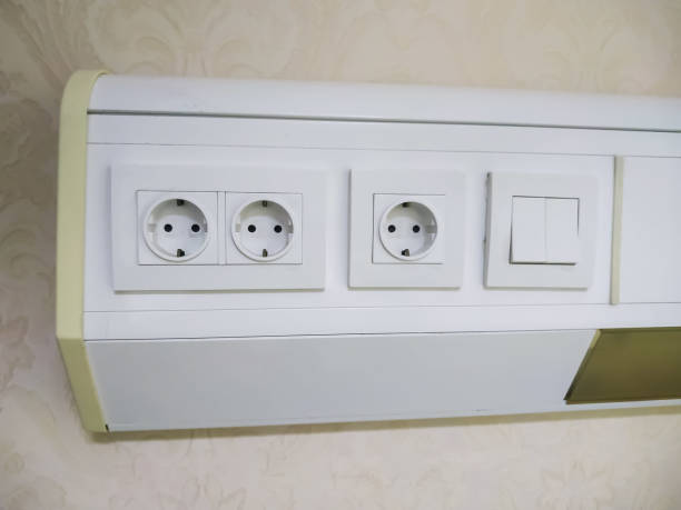 istock panel of light switches and electrical sockets on the wall. 1631485508